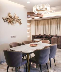 a dining room with a table and chairs at Housr Sector 41 Near Fortis Hospital in Gurgaon