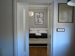 Posteľ alebo postele v izbe v ubytovaní Apartament Black & White w Centrum Gdyni III
