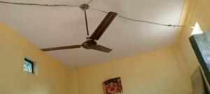 a ceiling fan hanging from the ceiling of a room at Singh Homestay in Kākora