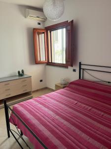 Postel nebo postele na pokoji v ubytování Casa indipendente con vista mare