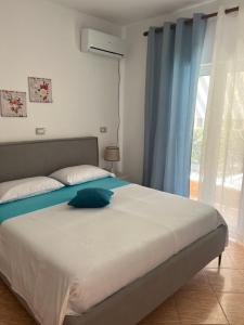 Postel nebo postele na pokoji v ubytování Hotel Portokali
