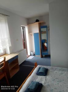 Postel nebo postele na pokoji v ubytování Dom Kącik