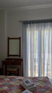 A bed or beds in a room at Mesohori studios