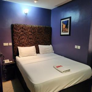 Postel nebo postele na pokoji v ubytování HOD Apartments