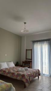 A bed or beds in a room at Mesohori studios