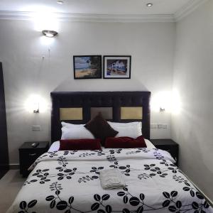 Postel nebo postele na pokoji v ubytování HOD Apartments