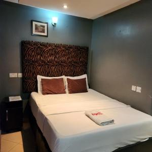 Postel nebo postele na pokoji v ubytování HOD Apartments