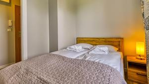 Postel nebo postele na pokoji v ubytování Mariental Residence, Sun & Snow