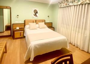 Ένα ή περισσότερα κρεβάτια σε δωμάτιο στο Hotel Spa Galatea