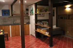 a room with a loft bed and a kitchen at Villa Trinacria in Agrigento