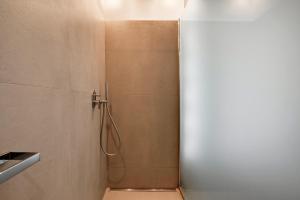 a shower in a bathroom with a glass door at Villa Etchola - Moutchic -3 étoiles in Lacanau +32 photos