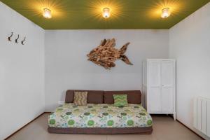 a bedroom with a bed with a starfish on the wall at Villa Etchola - Moutchic -3 étoiles in Lacanau