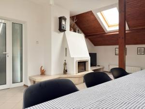 a room with a table and chairs and a fireplace at Corner house apartment in Montana +67 photos