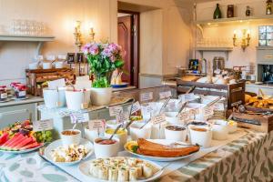 a buffet with various food items on a table at Hotel Astor in Vaasa