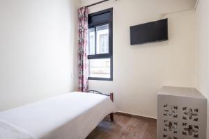 Hotel Mauritania的电视和/或娱乐中心