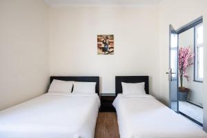 Hotel Mauritania客房内的一张或多张床位