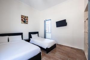 Hotel Mauritania客房内的一张或多张床位