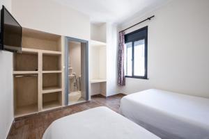 Hotel Mauritania客房内的一张或多张床位
