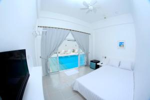 Postel nebo postele na pokoji v ubytování Coron Bluewave Hotel
