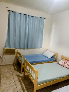 Postel nebo postele na pokoji v ubytování Mega Hotel
