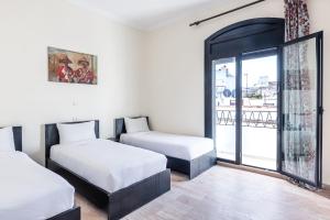 Hotel Mauritania客房内的一张或多张床位