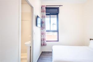 Hotel Mauritania客房内的一张或多张床位
