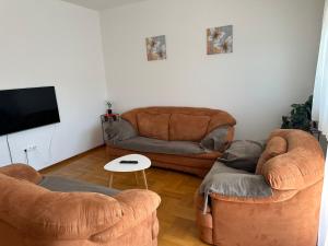 a living room with two chairs and a couch at Apartment Jure in Međugorje