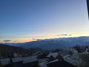 a view of a town with mountains in the background at Le Panorama de Valberg in Valberg