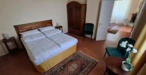 Postel nebo postele na pokoji v ubytování La Kascina Suite & Rooms