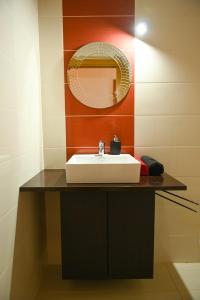 a bathroom with a sink and a mirror at Fabulous 5 BR hidden gem Serra da Estrela in Vinhó +61 photos
