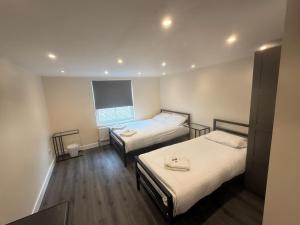 Postel nebo postele na pokoji v ubytování Saba Hotel London