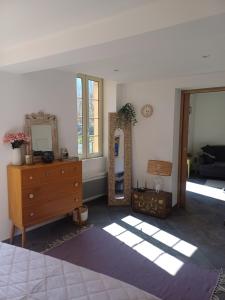 a room with two mirrors and a dresser in a room at À côté du Pont Vieux - By the Old Bridge in Sospel +20 photos