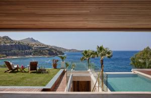 a view of the ocean from the balcony of a house at Rose Beach Garden in Bodrum City