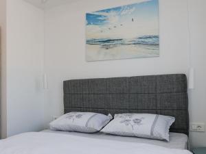 En eller flere senge i et værelse på Apartment Con Amore