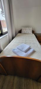 Postel nebo postele na pokoji v ubytování Apartman Kosta