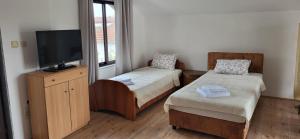 Postel nebo postele na pokoji v ubytování Apartman Kosta
