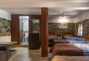 Uma cama ou camas num quarto em Guesthouse of Manoni Ratiani