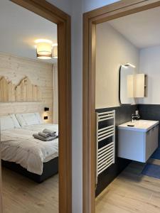 Ένα ή περισσότερα κρεβάτια σε δωμάτιο στο Mountain & Lodge