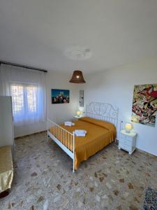 A bed or beds in a room at Il Vicolo Palinuro