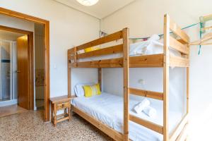 En eller flere senge i et værelse på rentafive - Bungalow - Terraza - Gran Playa