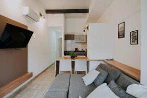 a living room with a couch and a table at Mendoza Apartments in Mendoza