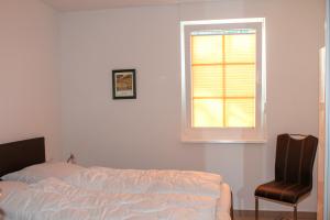 Postel nebo postele na pokoji v ubytování Fewo Kleine Meeresbrise / Villa Christine