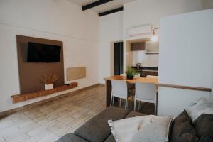 a living room with a couch and a table at Mendoza Apartments in Mendoza