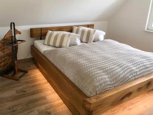 a bed with two pillows on it in a room at FH Ankerplatz in Güstow