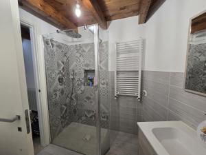 a bathroom with a shower and a sink at Suite nel centro storico di Cagliari in Cagliari