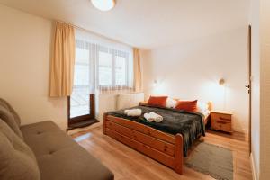 Ένα ή περισσότερα κρεβάτια σε δωμάτιο στο Horský hotel Bartoška