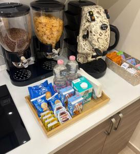 a counter with a tray of food and a blender at Vikolo Apartments in Naples