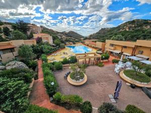 an aerial view of a resort with a swimming pool at Wild Paradise in Costa Paradiso