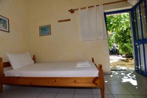 Postel nebo postele na pokoji v ubytování Anonymous Homestay