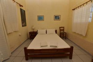 Postel nebo postele na pokoji v ubytování Anonymous Homestay
